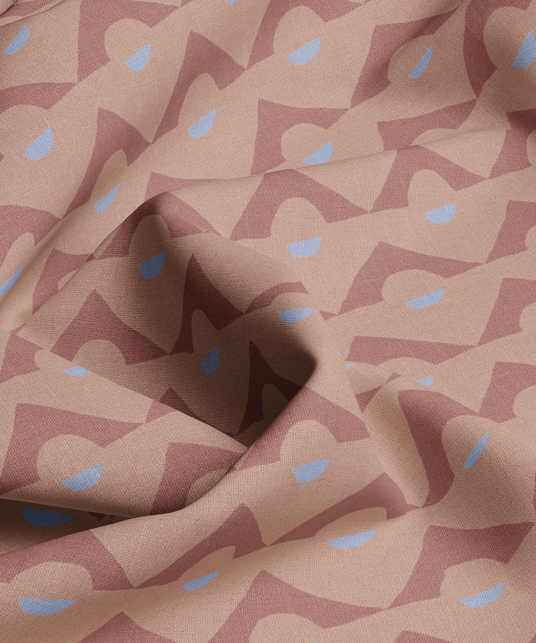 Fabric with abstract pattern of triangles and blue shapes on a brown background