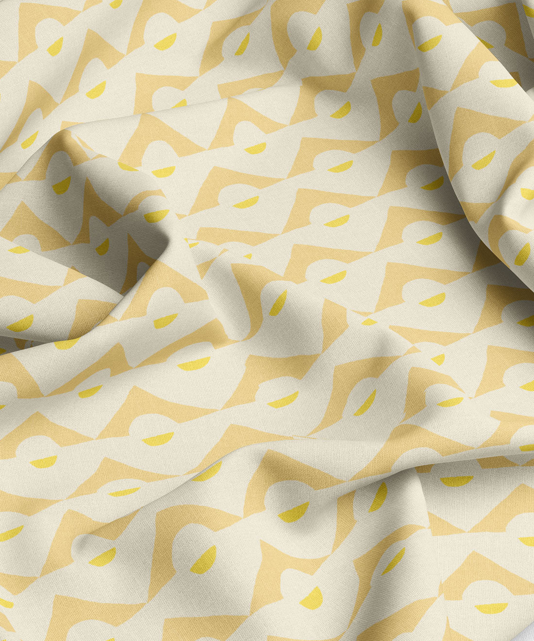 Fabric with a pattern of white shapes on a yellow background