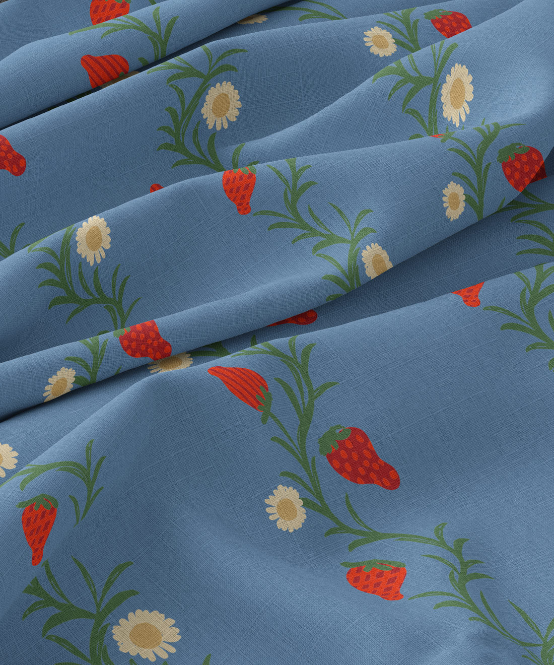 Fabric with strawberry and daisy pattern on a blue background
