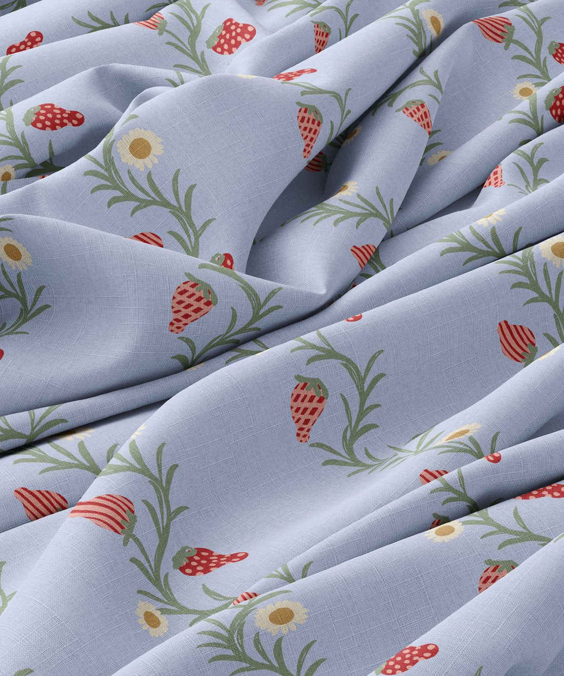 Fabric with strawberry and flower pattern on a light blue background