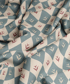 Fabric with a geometric pattern featuring blue and red colors