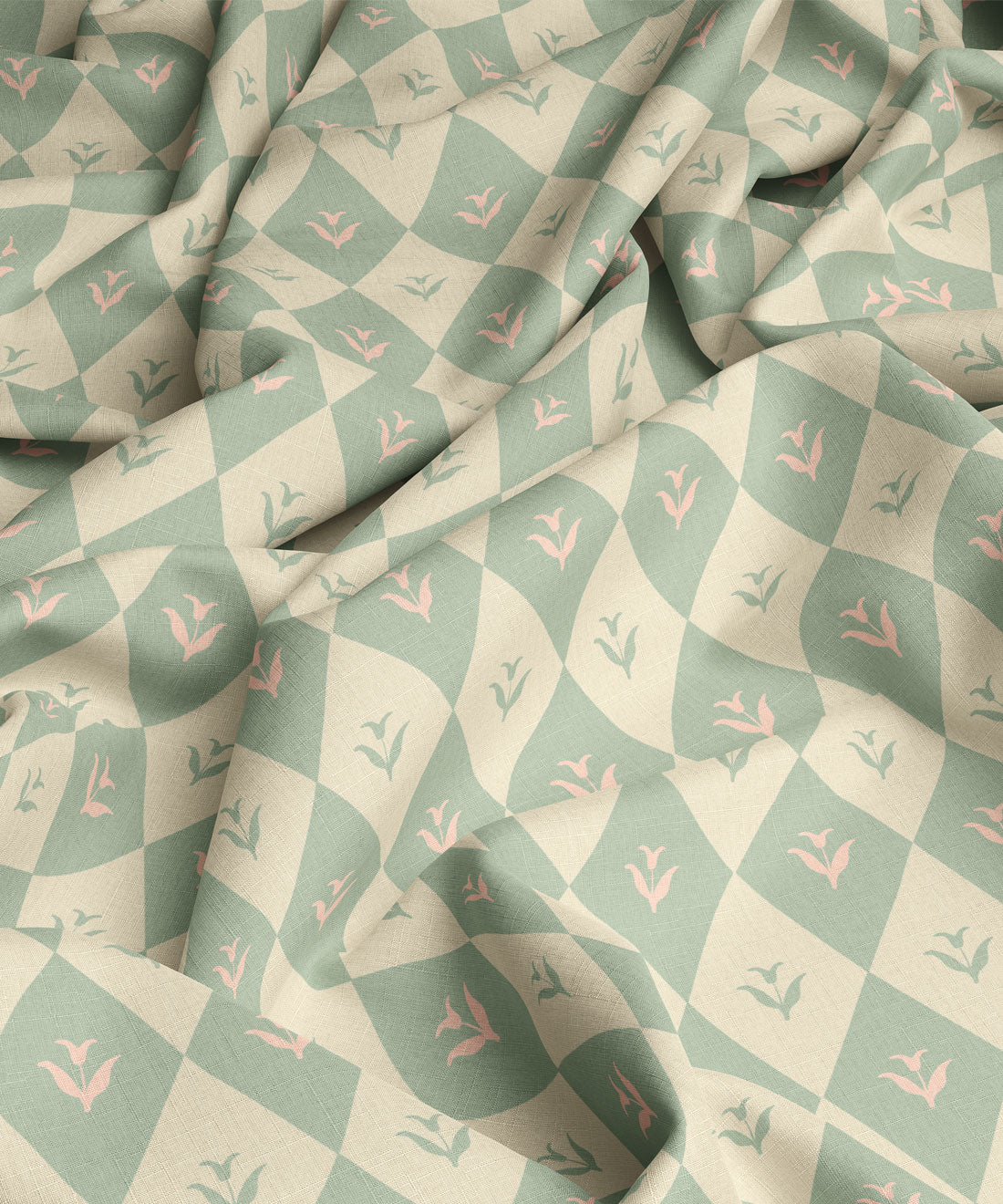 Fabric with a pattern of green and pink diamonds with flowers in middle