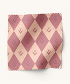 Diamond patterned fabric with flowers in light and dark pink