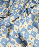 Fabric with a diamond pattern in blue and brown