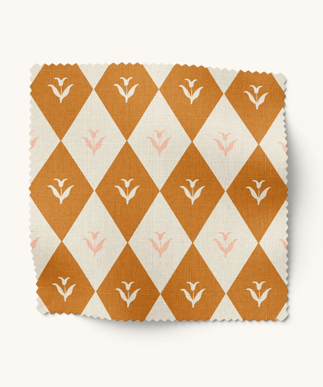 Fabric swatch with floral orange and white diamond pattern on a white background