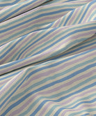Striped fabric with blue and purple lines on a beige background