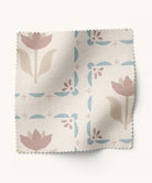 blue and taupe fabric with floral pattern on a white background