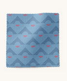 Blue fabric swatch with geometric pattern on a white background