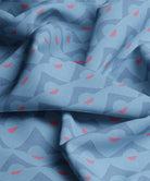 Blue  and red fabric with abstract pattern by Gray Benko Home