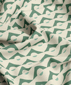 Fabric with green and white abstract pattern