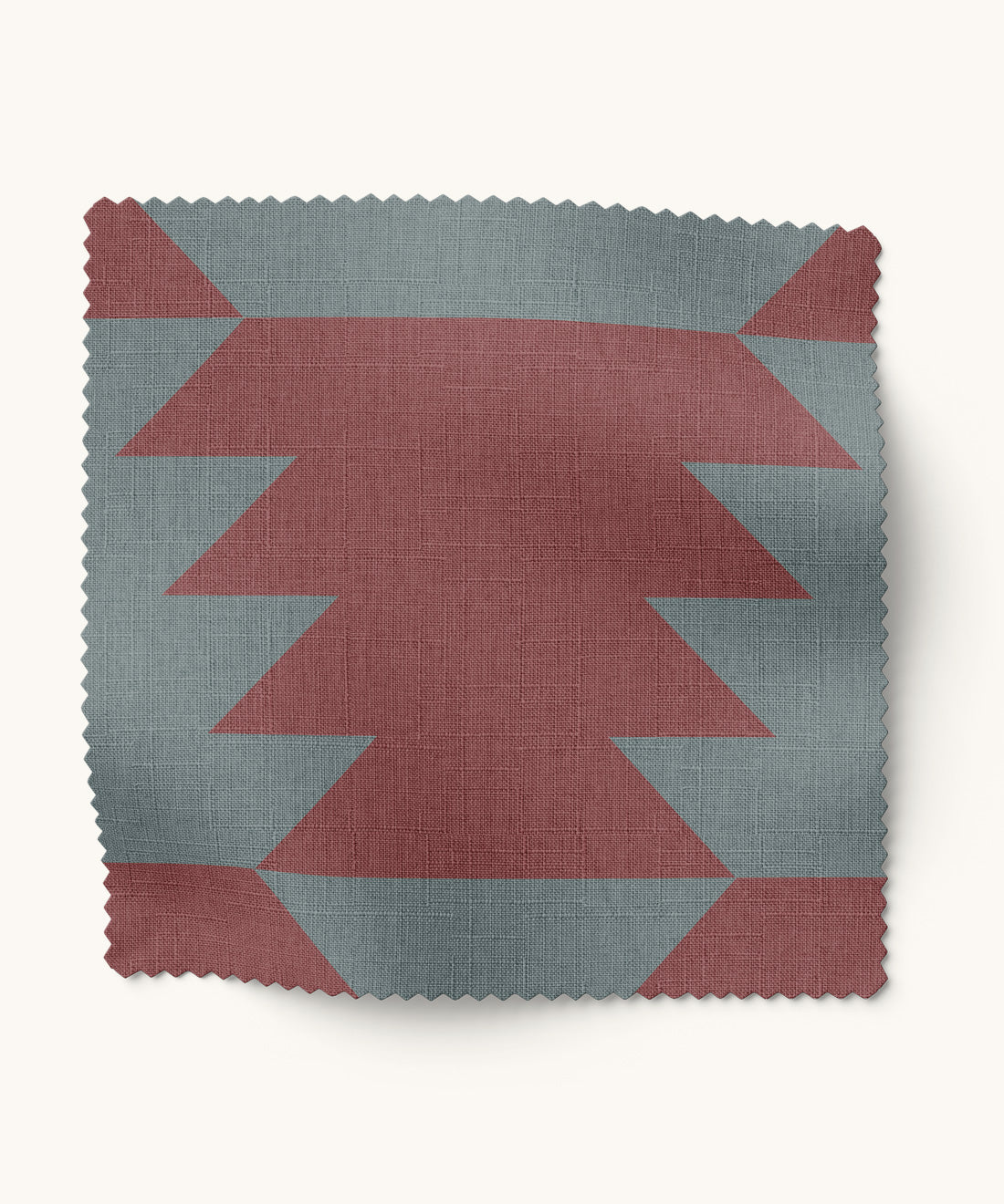 Fabric swatch with geometric pattern  in burgundy and blue on a white background