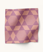 Fabric swatch with magenta geometric pattern on a white background