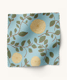 Blue and yellow floral patterned fabric by Gray Benko Home