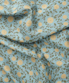 Fabric with floral pattern on a blue background