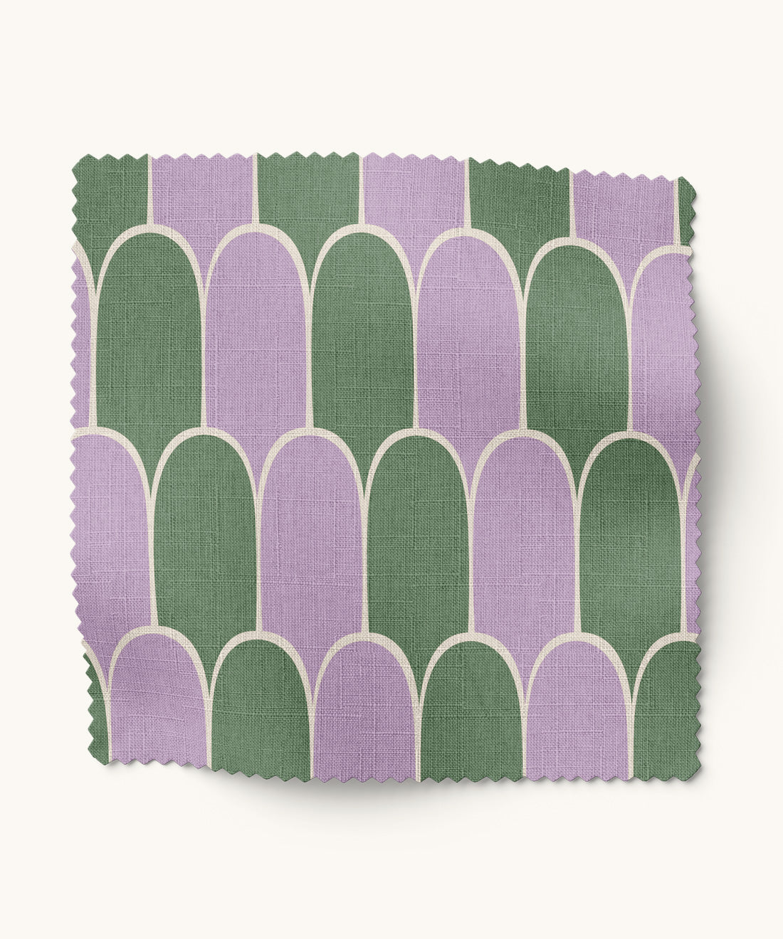 Fabric swatch with green and purple geometric pattern on a white background