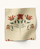 Floral patterned fabric in burnt orange and magenta by Gray Benko Home