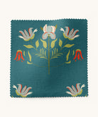 Fabric with floral pattern on a teal background by Gray Benko Home