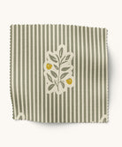 Green striped fabric with leaf pattern
