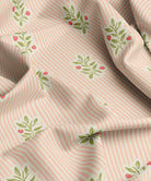 Fabric with pink stripes and green leaf patterns 