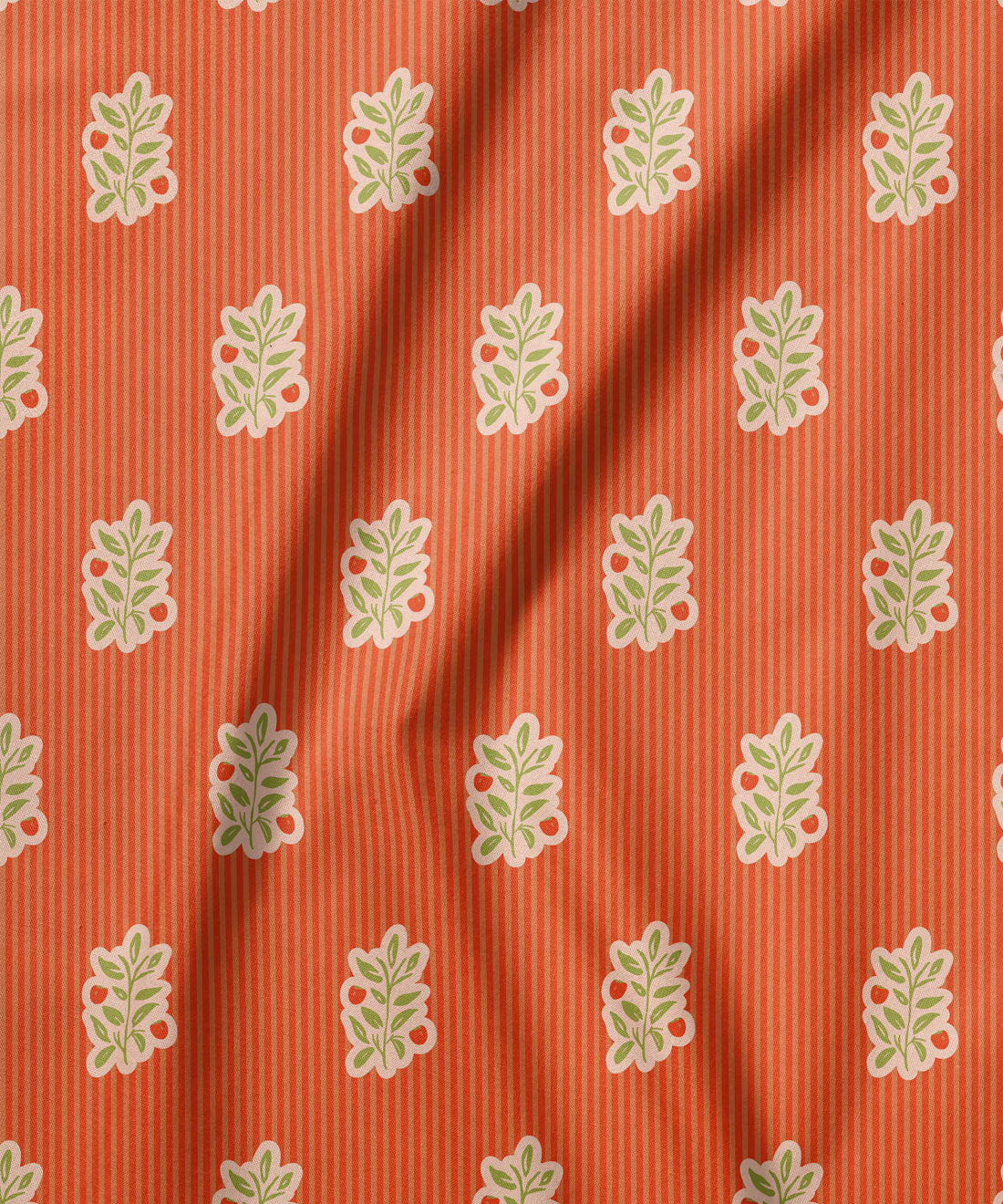 Fabric with a leaf pattern on an orange striped background