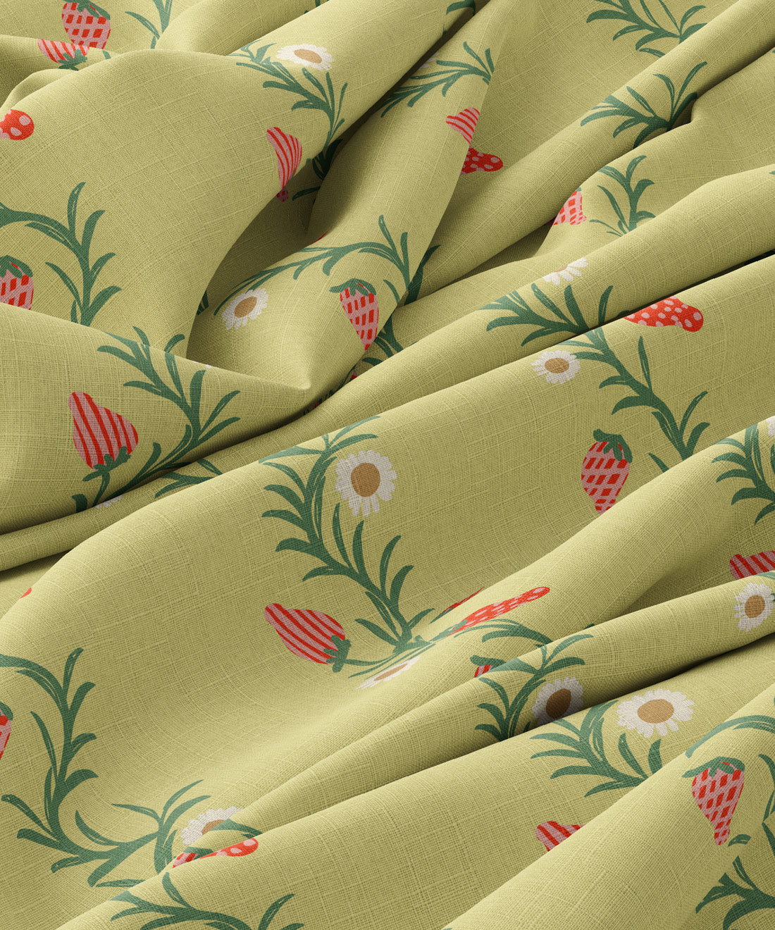 Close-up of green fabric with floral and strawberry pattern