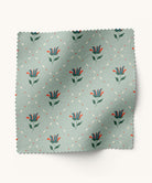Fabric with floral pattern on a light blue background by Gray Benko Home