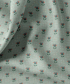 Fabric with floral pattern on a light blue background by Gray Benko Home