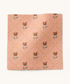 Fabric with floral pattern on a peach background by Gray Benko Home