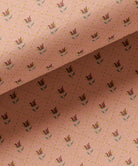 Fabric with floral pattern on a peach background by Gray Benko Home