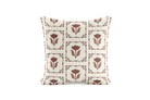 Decorative pillow with brown and black floral pattern on a white background