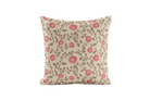 Decorative pillow with red floral pattern on a beige background