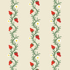 A roll of wallpaper with a repeating pattern of red strawberries and green leaves on an ivory background.