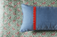 The Charlie Pillow in Prisma in Denim with Poppy Scalloped Tape Stripes by Wheaton Whaley Home