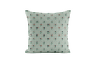 Decorative pillow with floral pattern on a light blue background