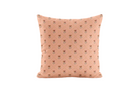 Pink pillow with small trellis pattern on a white background