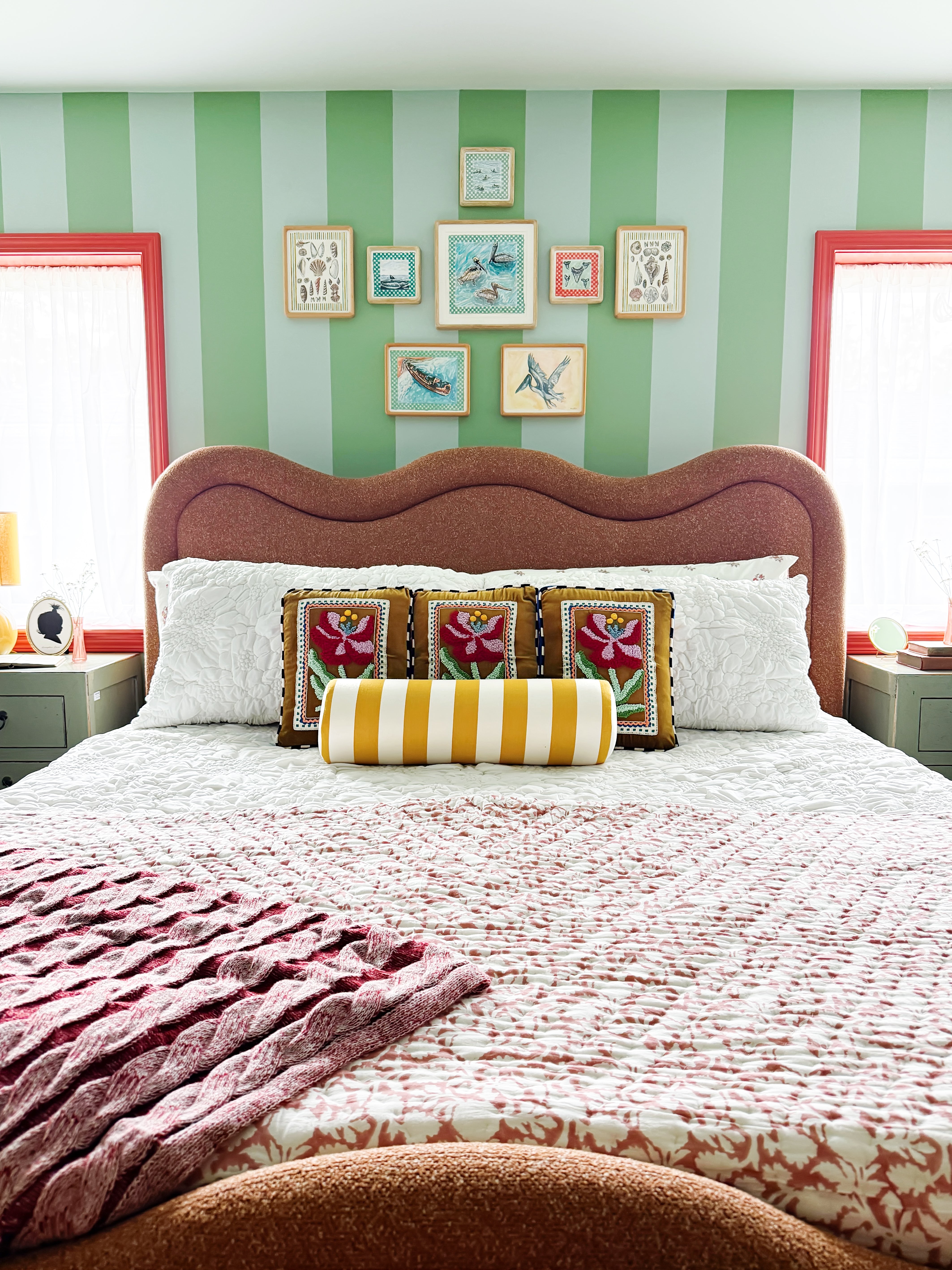 Striped green bedroom with red paint trim 