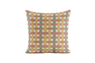 Decorative pillow with a geometric red, green and mustard pattern on a white background