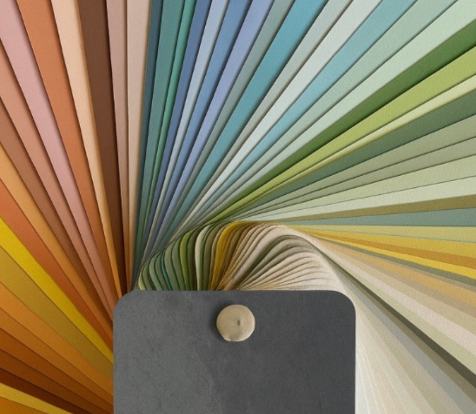 Color swatch book with a variety of colors including earth tones and pastels.